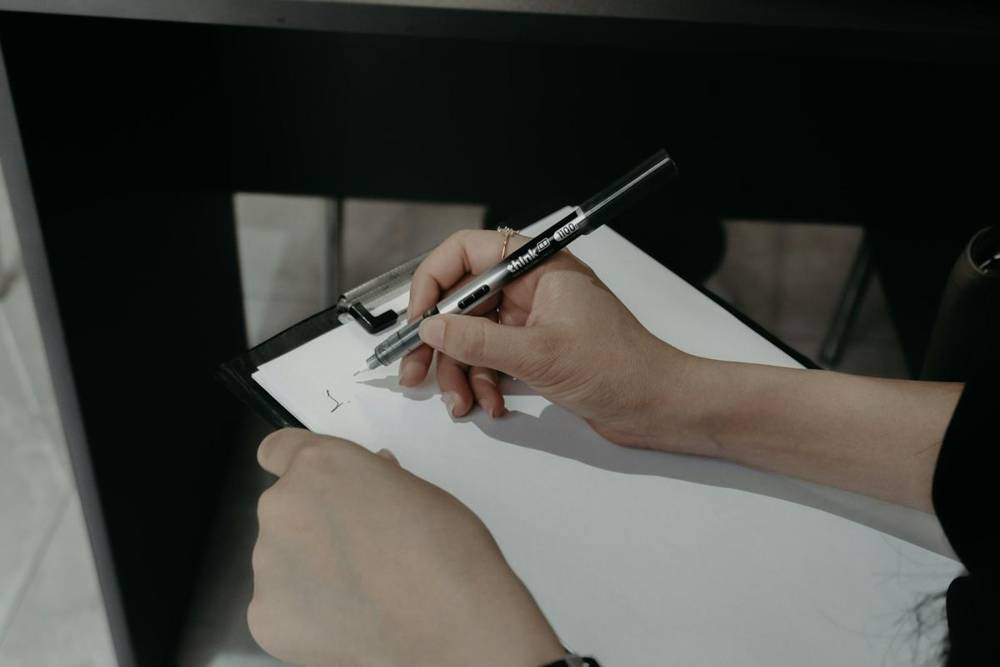 Writing notes on a clipboard