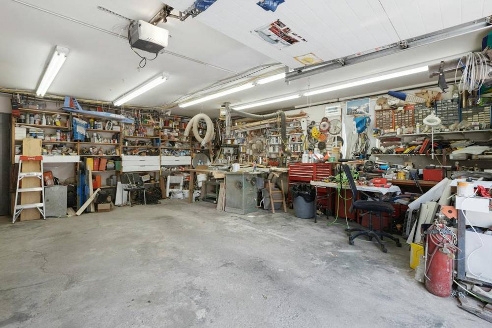Garage interior with a ceiling-mounted garage door opener