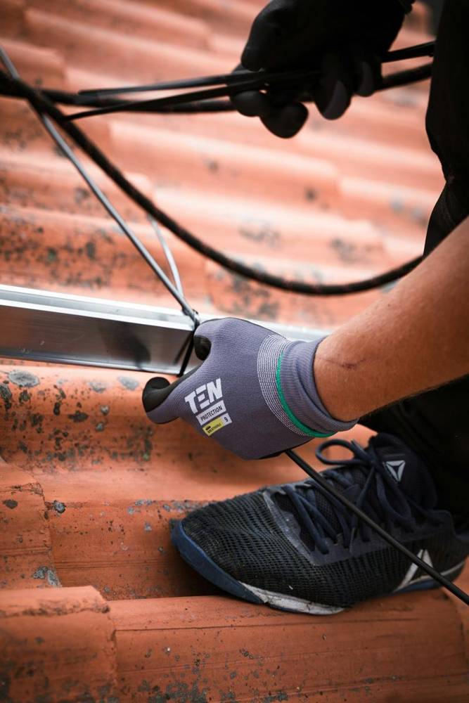 Gloved hands working with a cable