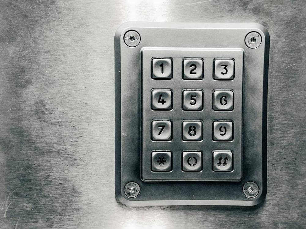 Metal push-button keypad on a wall