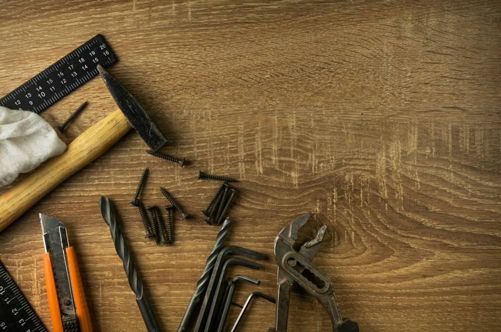 Hand tools on a wooden workbench