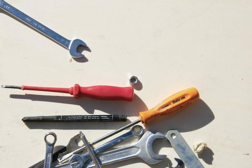 Wrenches and screwdrivers on a table